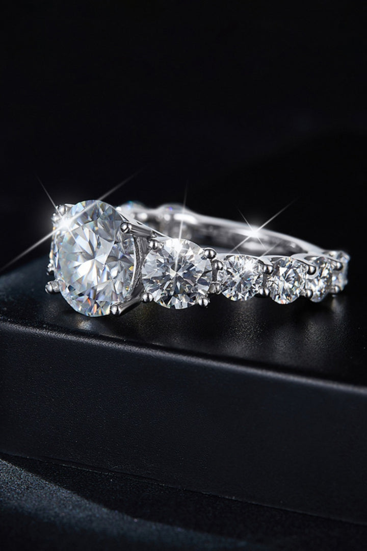Moissanite silver ring, Sterling silver jewelry, Lab-created gemstone, 8-carat statement piece, Sparkling centerpiece, Affordable luxury ring, Elegant sterling silver band, High-quality craftsmanship, Timeless beauty, Fine jewelry accessory.