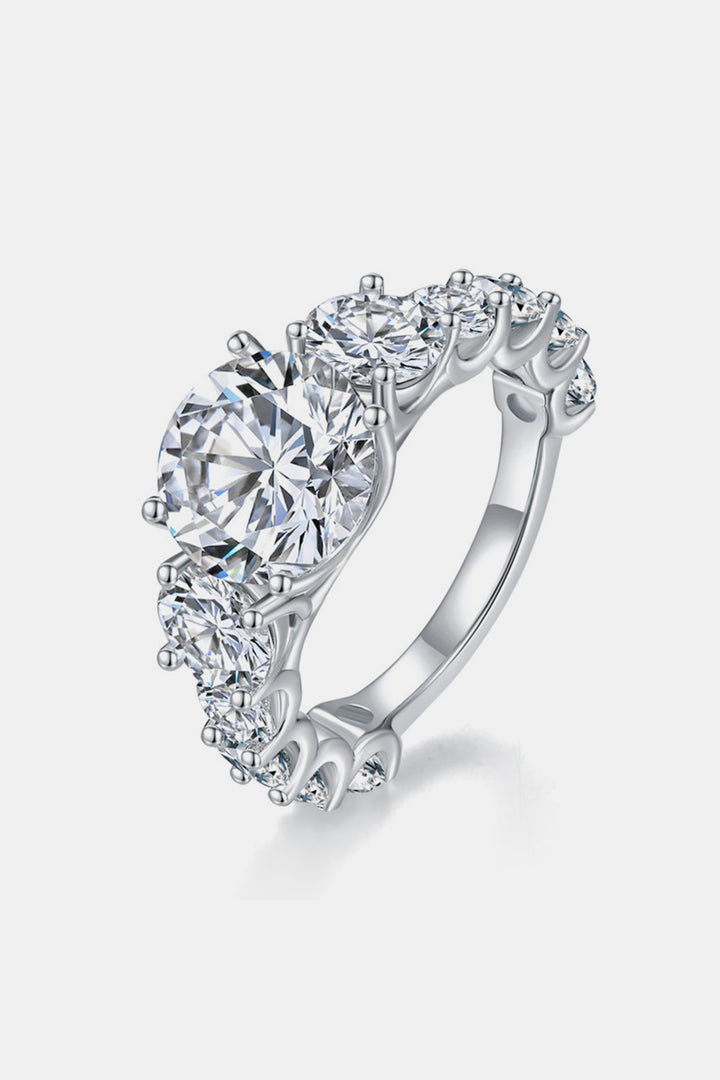 Moissanite silver ring, Sterling silver jewelry, Lab-created gemstone, 8-carat statement piece, Sparkling centerpiece, Affordable luxury ring, Elegant sterling silver band, High-quality craftsmanship, Timeless beauty, Fine jewelry accessory.
