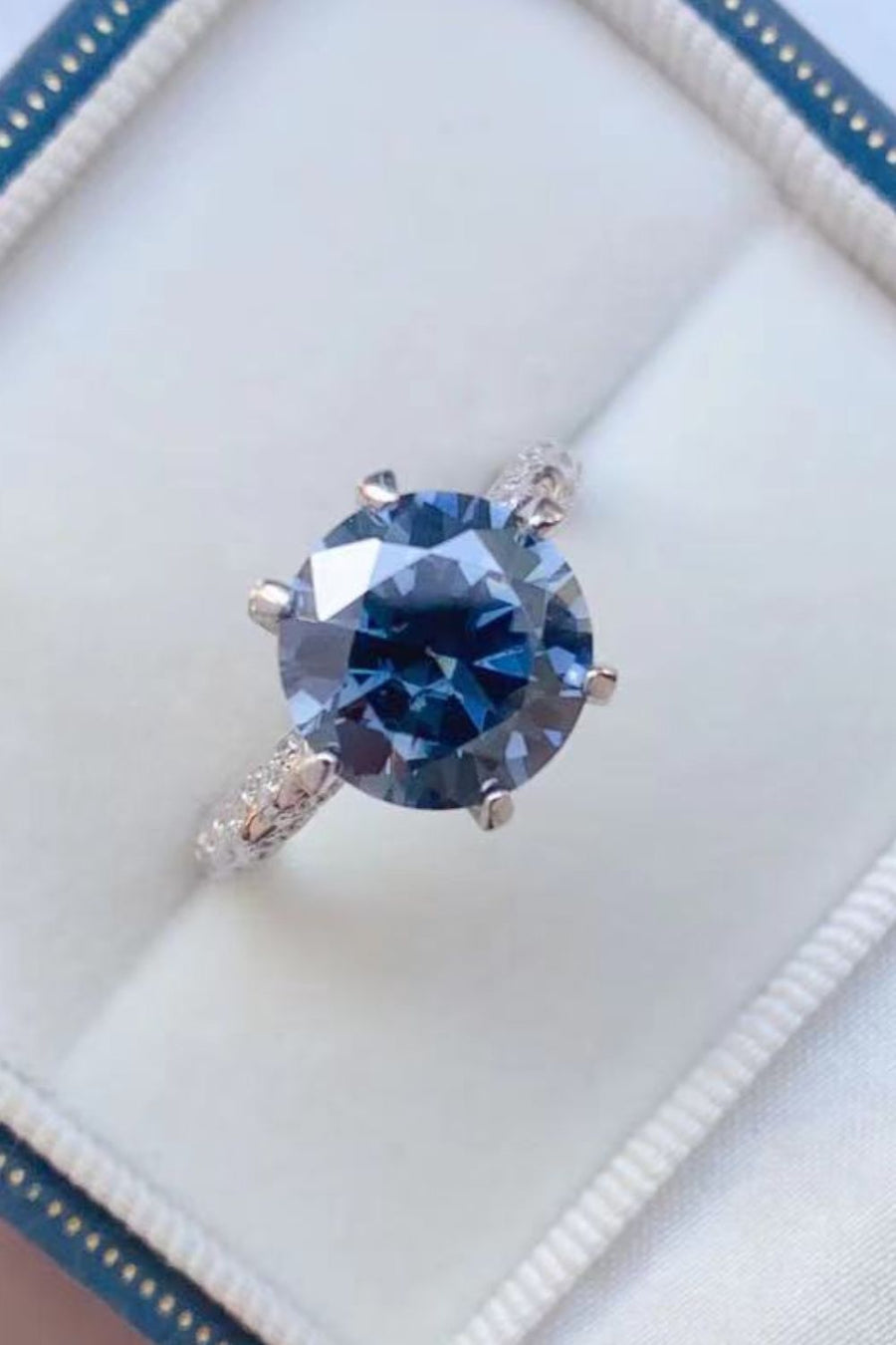 Moissanite ring, Sterling silver jewelry, Lab-created gemstone, 5-carat statement piece, Sparkling centerpiece, Affordable luxury ring, Elegant sterling silver band, High-quality craftsmanship, Timeless beauty, Fine jewelry accessory.