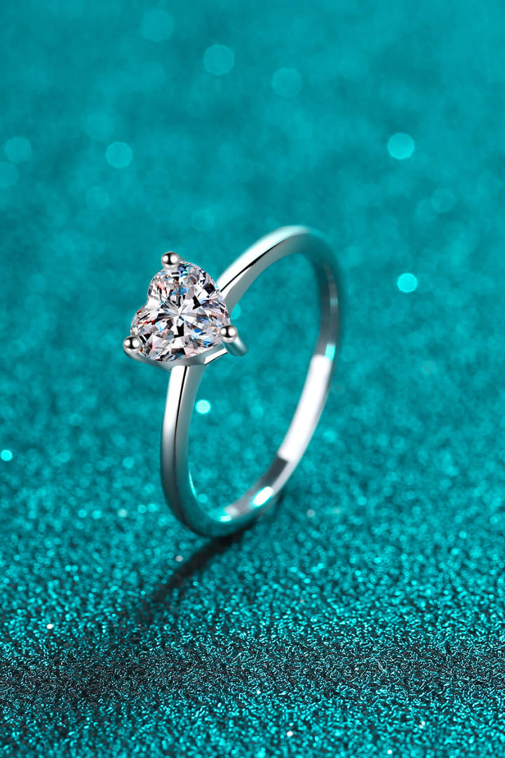 Sterling silver ring, Heart-shaped Moissanite, Solitaire ring, Elegant jewelry, Sparkling centerpiece, Fine silver accessory, High-quality craftsmanship, Timeless beauty, Romantic ring, Affordable luxury.