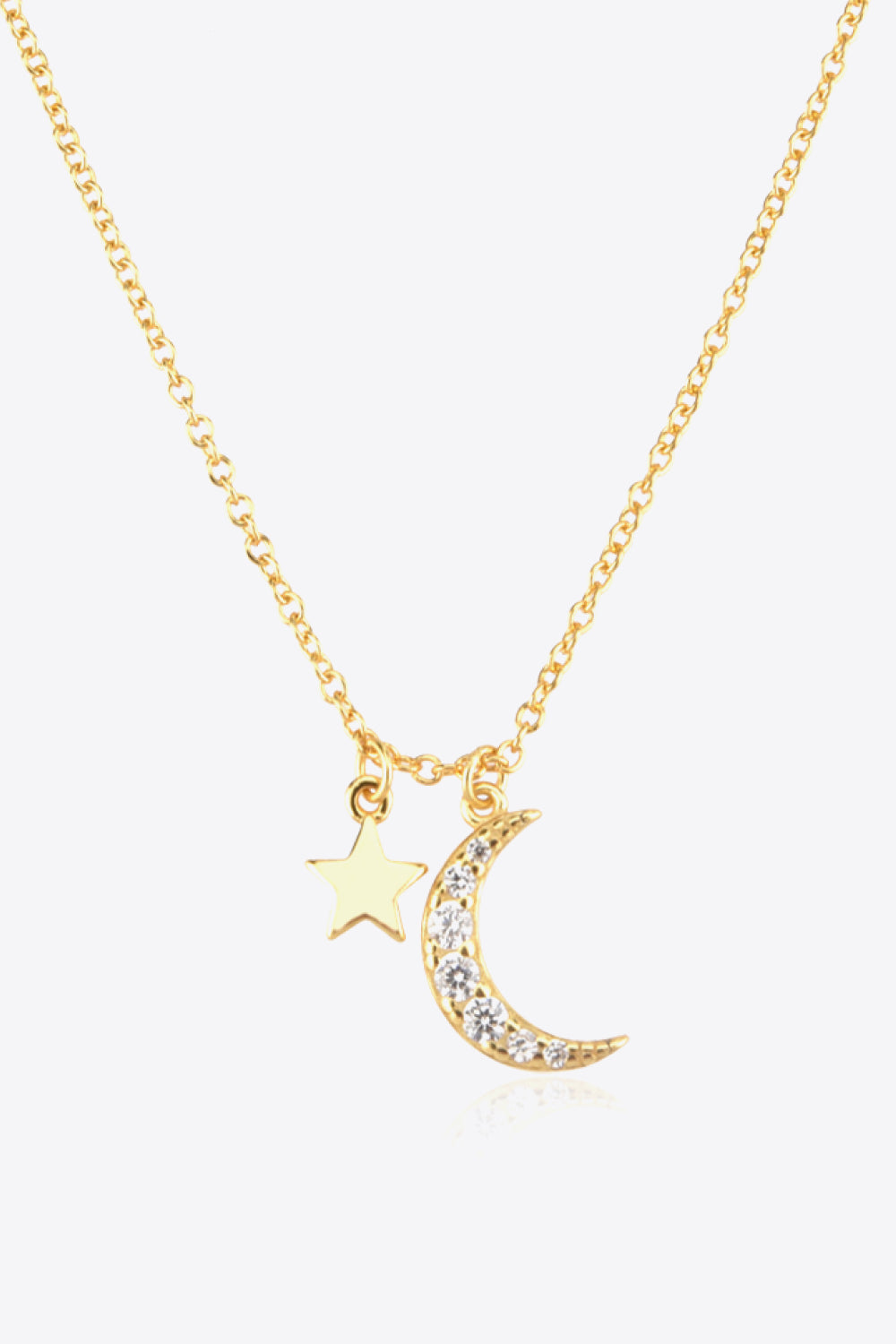 Zircon pendant necklace, star and moon design, celestial jewelry, fashion accessory, statement piece, elegant necklace, glamorous accessory, celestial theme, dainty details, versatile necklace