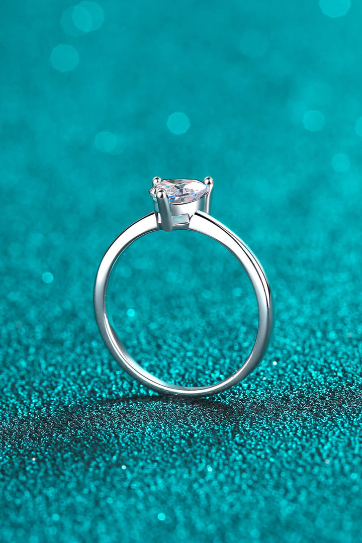 Sterling silver ring, Heart-shaped Moissanite, Solitaire ring, Elegant jewelry, Sparkling centerpiece, Fine silver accessory, High-quality craftsmanship, Timeless beauty, Romantic ring, Affordable luxury.