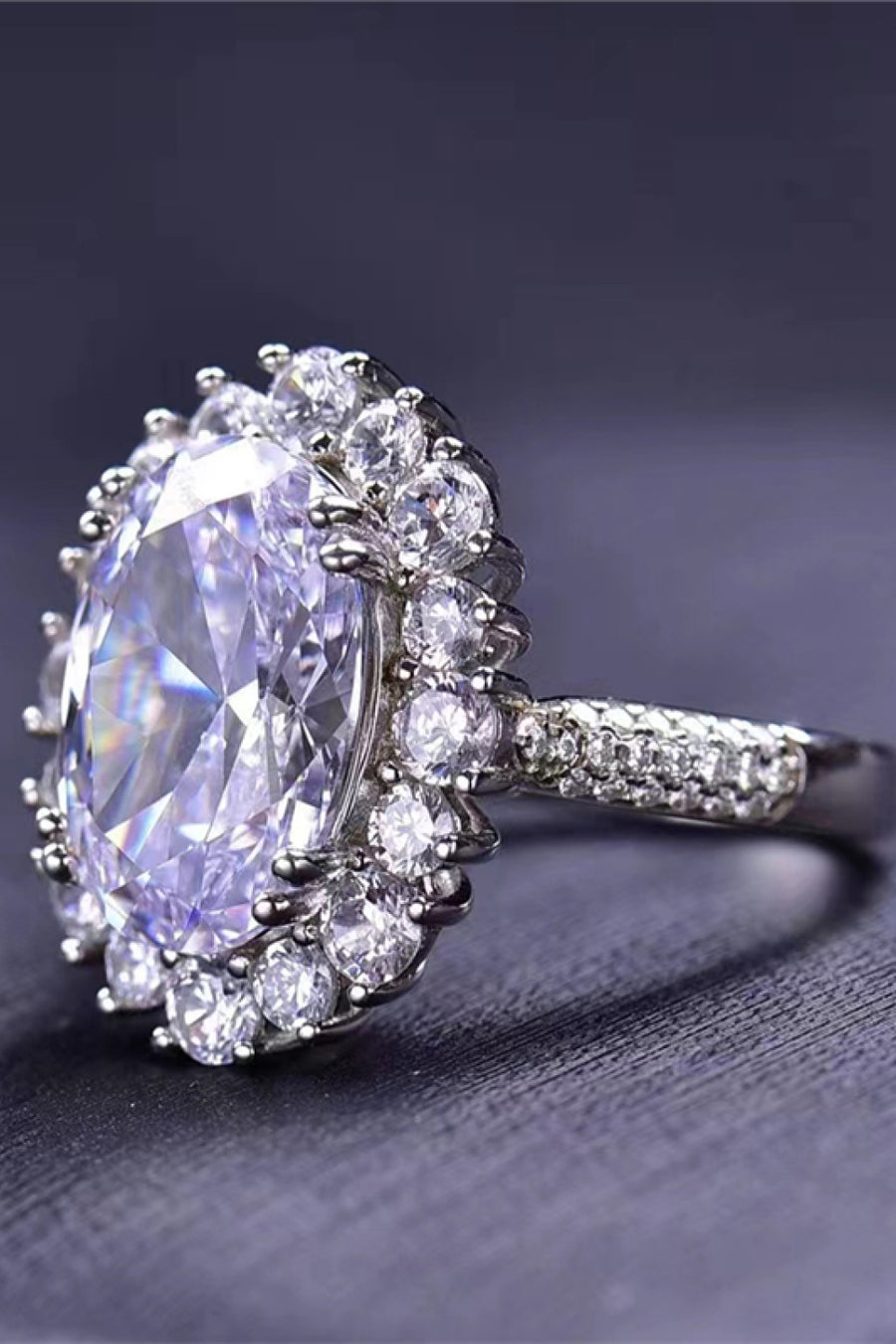 Oval Moissanite ring, Lab-created gemstone, 8-carat statement piece, Sparkling centerpiece, Luxury jewelry, Elegant design, High-quality craftsmanship, Timeless beauty, Fine jewelry accessory, Glamorous oval ring.