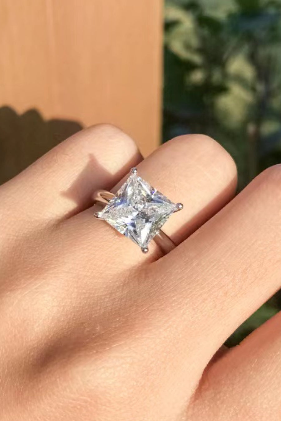 Moissanite solitaire ring, Lab-created gemstone, 5-carat statement piece, Sparkling centerpiece, Timeless elegance, Luxury jewelry, Classic design, High-quality craftsmanship, Affordable glamour, Fine jewelry accessory.