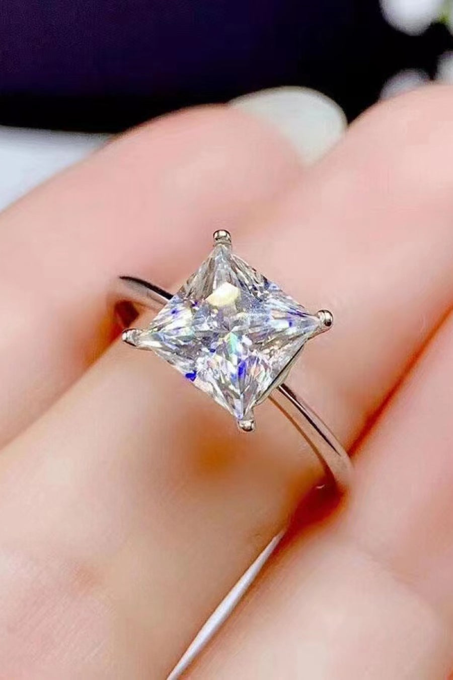 Moissanite solitaire ring, Lab-created gemstone, 5-carat statement piece, Sparkling centerpiece, Timeless elegance, Luxury jewelry, Classic design, High-quality craftsmanship, Affordable glamour, Fine jewelry accessory.