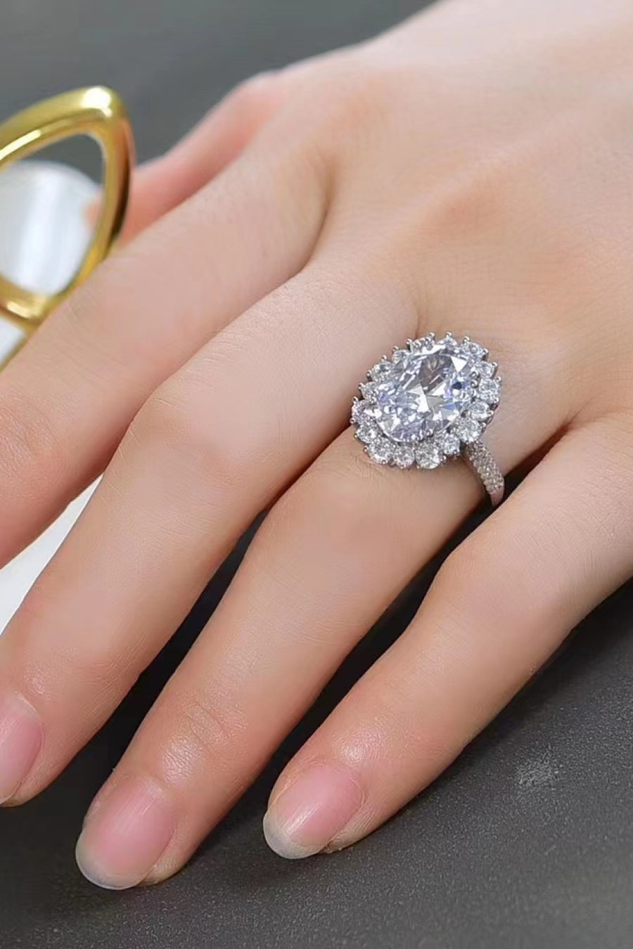 Oval Moissanite ring, Lab-created gemstone, 8-carat statement piece, Sparkling centerpiece, Luxury jewelry, Elegant design, High-quality craftsmanship, Timeless beauty, Fine jewelry accessory, Glamorous oval ring.