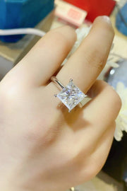 Moissanite solitaire ring, Lab-created gemstone, 5-carat statement piece, Sparkling centerpiece, Timeless elegance, Luxury jewelry, Classic design, High-quality craftsmanship, Affordable glamour, Fine jewelry accessory.