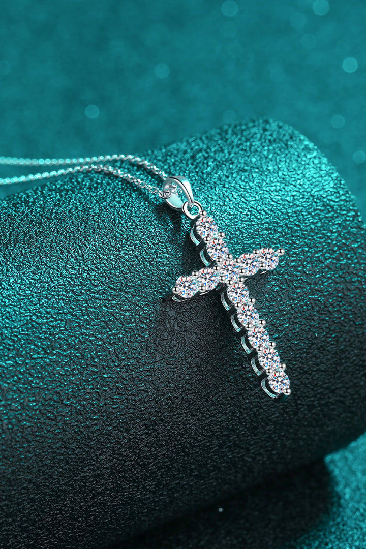 Sterling silver necklace, Cross pendant, Moissanite gemstone, Elegant jewelry, Religious necklace, Sparkling centerpiece, Fine silver accessory, High-quality craftsmanship, Timeless beauty, Meaningful necklace.