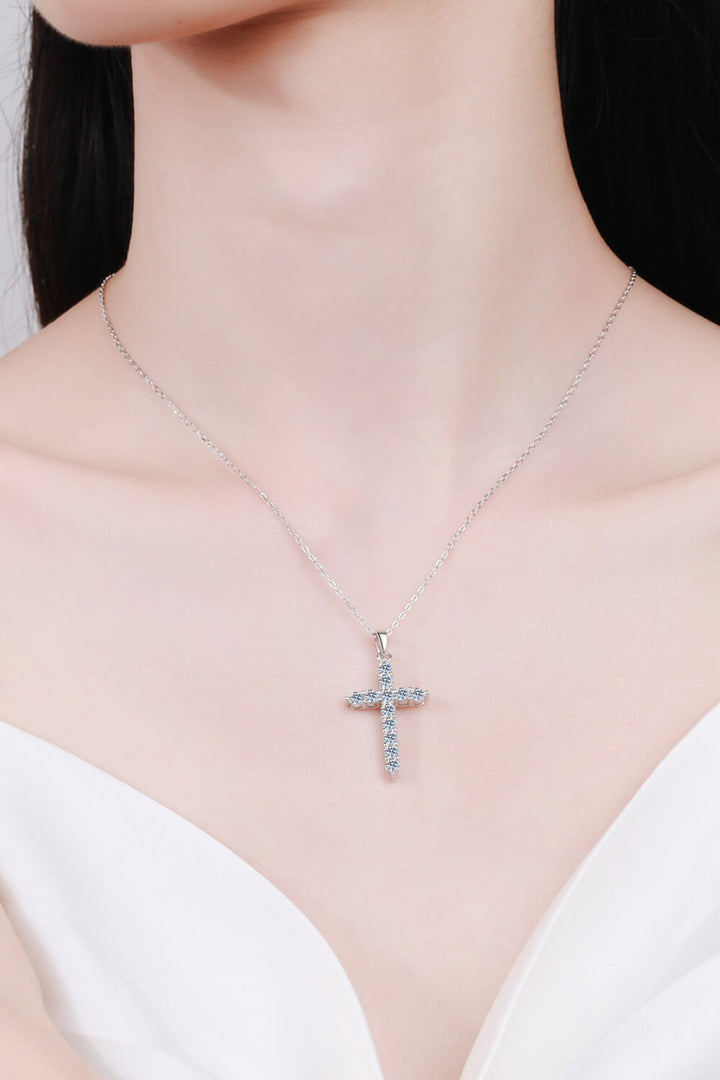 Sterling silver necklace, Cross pendant, Moissanite gemstone, Elegant jewelry, Religious necklace, Sparkling centerpiece, Fine silver accessory, High-quality craftsmanship, Timeless beauty, Meaningful necklace.