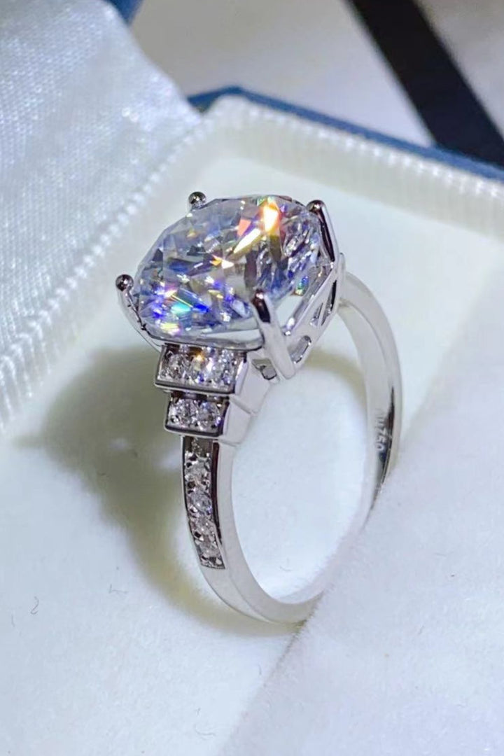 Moissanite silver ring, Sterling silver jewelry, Lab-created gemstone, 5-carat statement ring, Sparkling centerpiece, Affordable luxury ring, Elegant sterling silver band, High-quality craftsmanship, Timeless beauty, Fine jewelry accessory.
