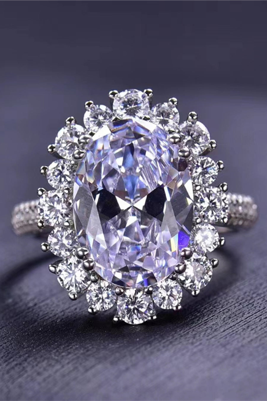 Oval Moissanite ring, Lab-created gemstone, 8-carat statement piece, Sparkling centerpiece, Luxury jewelry, Elegant design, High-quality craftsmanship, Timeless beauty, Fine jewelry accessory, Glamorous oval ring.