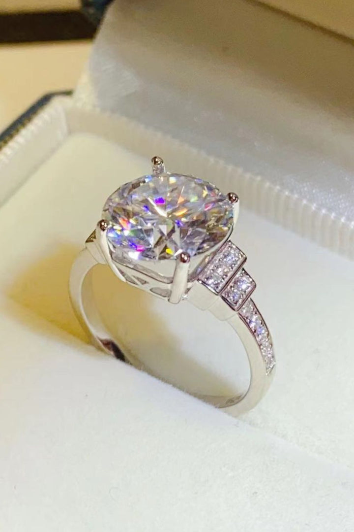 Moissanite silver ring, Sterling silver jewelry, Lab-created gemstone, 5-carat statement ring, Sparkling centerpiece, Affordable luxury ring, Elegant sterling silver band, High-quality craftsmanship, Timeless beauty, Fine jewelry accessory.