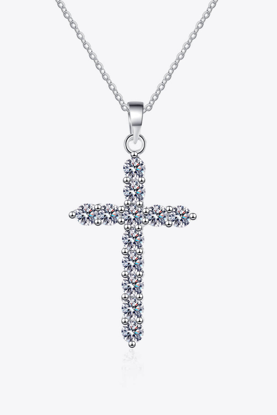 Sterling silver necklace, Cross pendant, Moissanite gemstone, Elegant jewelry, Religious necklace, Sparkling centerpiece, Fine silver accessory, High-quality craftsmanship, Timeless beauty, Meaningful necklace.