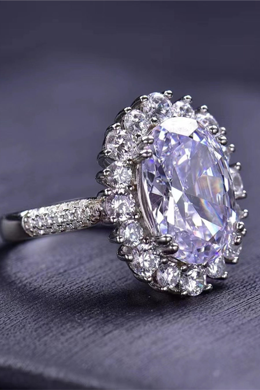 Oval Moissanite ring, Lab-created gemstone, 8-carat statement piece, Sparkling centerpiece, Luxury jewelry, Elegant design, High-quality craftsmanship, Timeless beauty, Fine jewelry accessory, Glamorous oval ring.